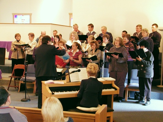 Choir Sings during signing