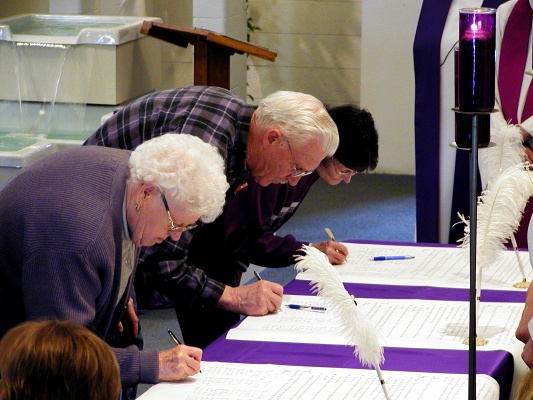 Choir Sings during signing